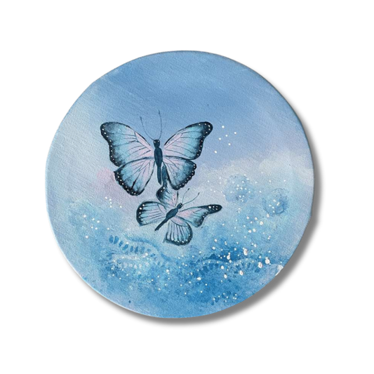 Pyöreä taulu, jossa kaksi sinistä perhosta | Kaikkea Kaunista